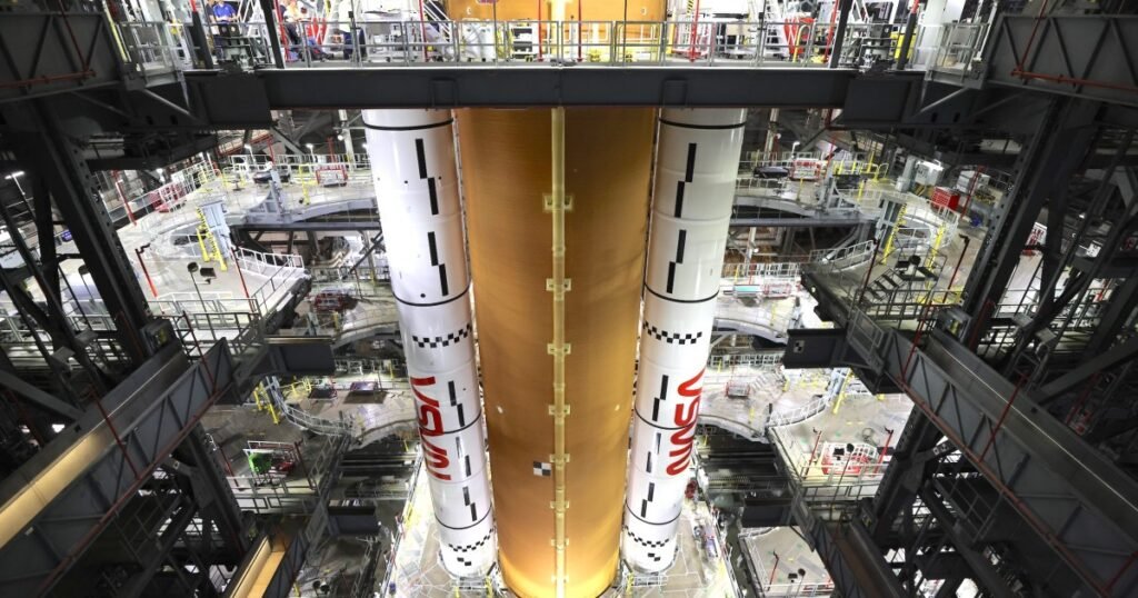 NASA moon rocket meets side boosters for crewed Artemis II